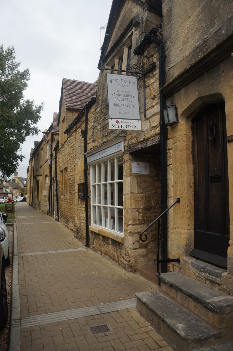 The stone street front with the hanging VICTOR’S sign